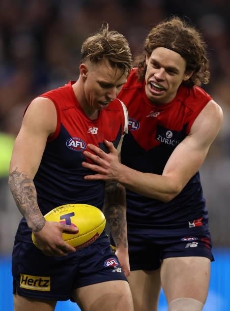 James Harmes of the Demons is spoken to tby team mate ben Brown during the AFL First Preliminary Final match between Melbourne Demons and Geelong...