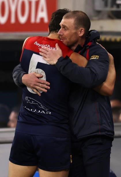 Christian Petracca of the Demons and Demons coach, Simon Goodwin embrace after the Demons defeated the Cats during the AFL First Preliminary Final...