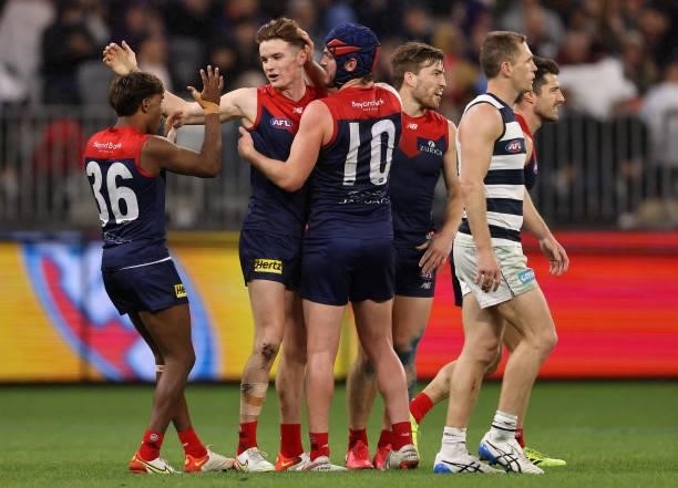 The Demons celebrate after they defeated the Cats during the AFL First Preliminary Final match between Melbourne Demons and Geelong Cats at Optus...