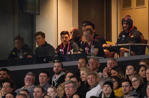 Demons players look on during the AFL First Preliminary Final match between Melbourne Demons and Geelong Cats at Optus Stadium on September 10, 2021...