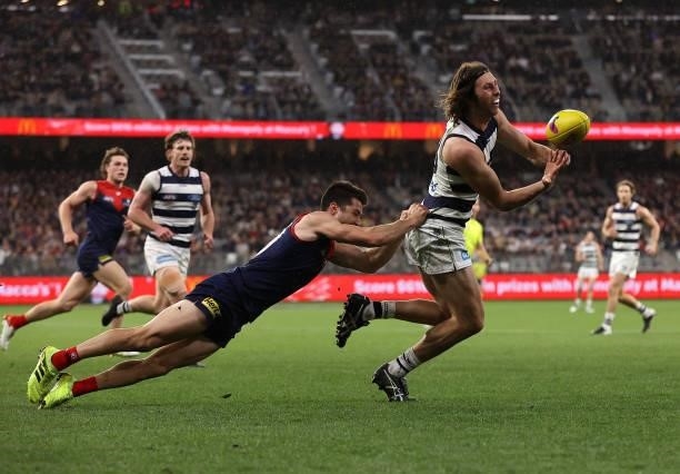Jack Henry of the Cats handballs during the AFL First Preliminary Final match between Melbourne Demons and Geelong Cats at Optus Stadium on September...