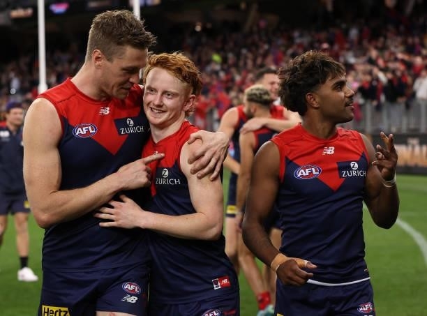 Tom McDonald, Jake Bowey and Kysaiah Pickett of the Demons celebrate after the Demons defeated the Cats during the AFL First Preliminary Final match...