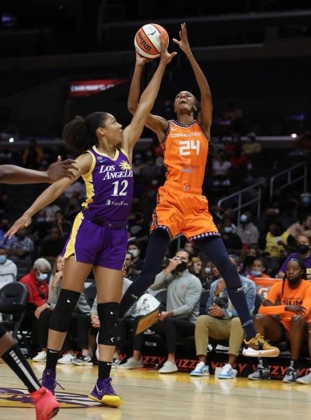 DeWanna Bonner of the Connecticut Sun takes a shot against Nia Coffey of the Los Angeles Sparks in the first quarter at Staples Center on September...