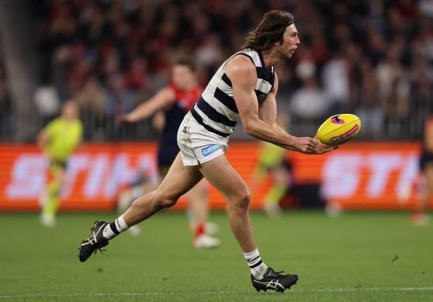Jack Henry of the Cats looks to handball during the AFL First Preliminary Final match between the Melbourne Demons and Geelong Cats at Optus Stadium...
