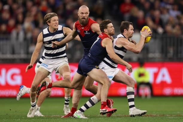 Jack Viney of the Demons tackles Patrick Dangerfield of the Cats during the AFL First Preliminary Final match between the Melbourne Demons and...