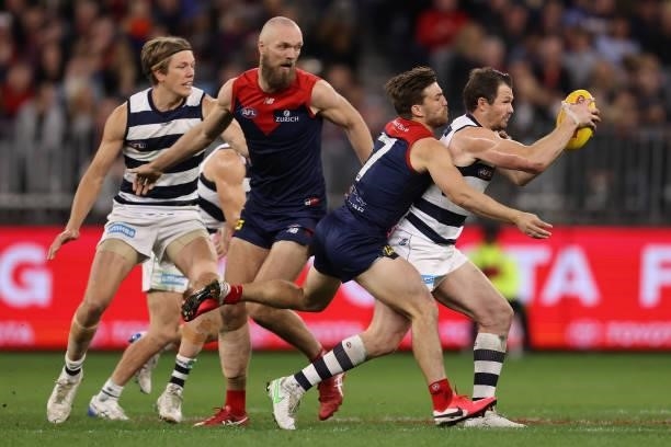 Jack Viney of the Demons tackles Patrick Dangerfield of the Cats during the AFL First Preliminary Final match between the Melbourne Demons and...