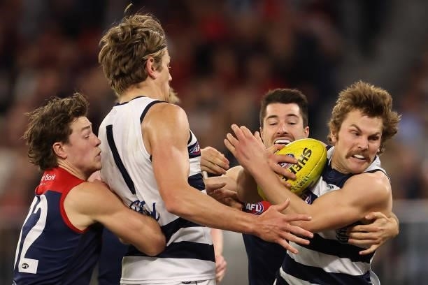 Tom Atkins of the Cats looks to break from a tackle during the AFL First Preliminary Final match between the Melbourne Demons and Geelong Cats at...