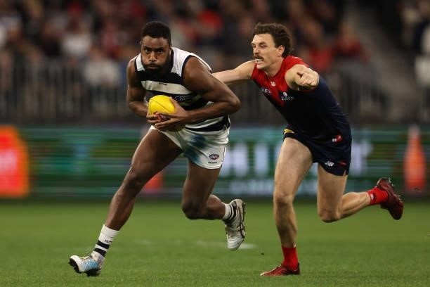 Esava Ratugolea of the Cats gets tackled by Jake Lever of the Demons during the AFL First Preliminary Final match between the Melbourne Demons and...