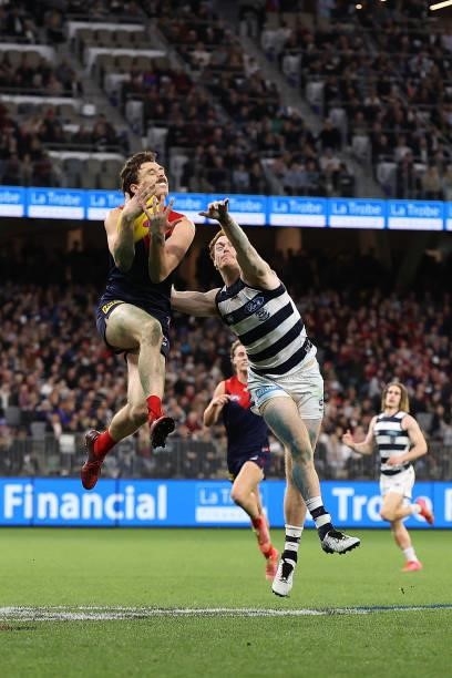 Jake Lever of the Demons marks the ball against Gary Rohan of the Cats during the AFL First Preliminary Final match between the Melbourne Demons and...