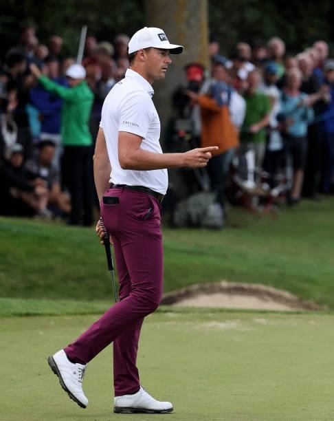 Victor Perez of France celebrates making a putt on the 18th green during Day Two of The BMW PGA Championship at Wentworth Golf Club on September 10,...