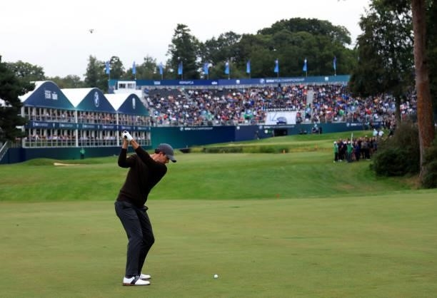 Adam Scott of Australia plays his second shot into the 18th green during the second round of The BMW PGA Championship at Wentworth Golf Club on...