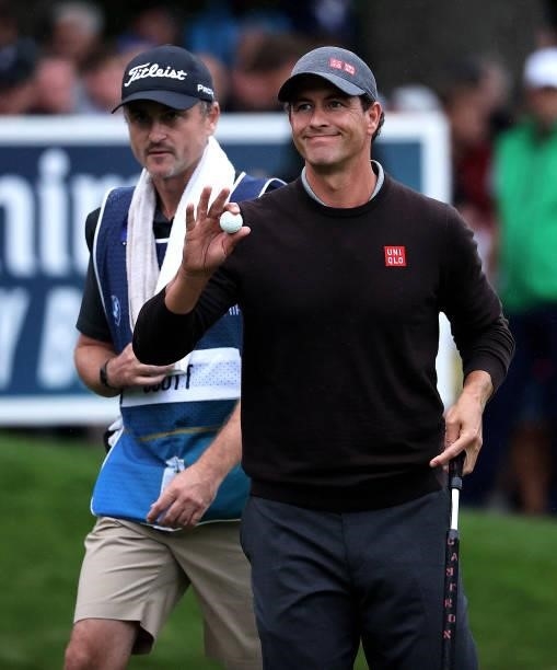 Adam Scott of Australia acknowledges the crowd after finishing his round on the 18th during Day Two of The BMW PGA Championship at Wentworth Golf...