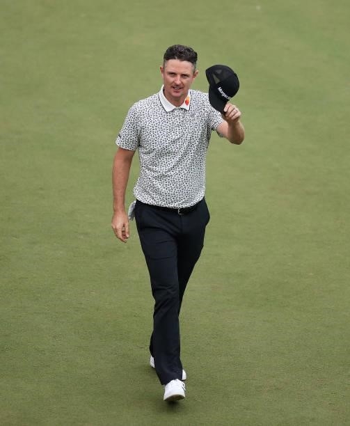 Justin Rose of England acknowledges the crowd after finishing his round on the 18th during Day Two of The BMW PGA Championship at Wentworth Golf Club...