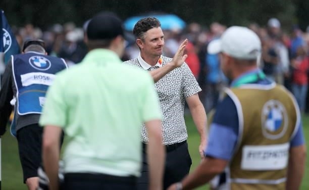 Justin Rose of England acknowledges the crowd after finishing his round on the 18th during Day Two of The BMW PGA Championship at Wentworth Golf Club...