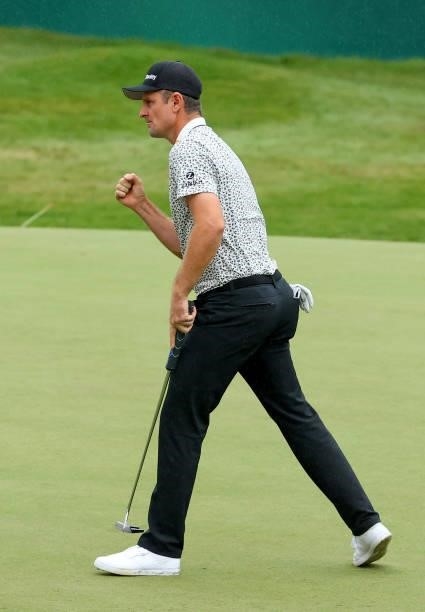 Justin Rose of England celebrates after his birdie on the 18th hole during the second round of The BMW PGA Championship at Wentworth Golf Club on...