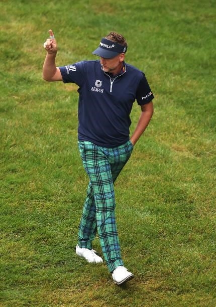 Ian Poulter of England acknowledges the crowd, after chipping in on the 18th hole during Day Two of The BMW PGA Championship at Wentworth Golf Club...