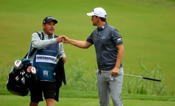 Bernd Wiesberger of Austria and his caddie on the 18th hole during the second round of The BMW PGA Championship at Wentworth Golf Club on September...