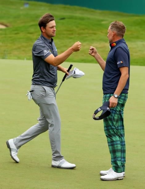 Bernd Wiesberger of Austria and Ian Poulter of England on the 18th hole during the second round of The BMW PGA Championship at Wentworth Golf Club on...