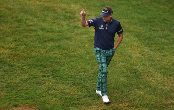 Ian Poulter of England acknowledges the crowd, after chipping in on the 18th hole during Day Two of The BMW PGA Championship at Wentworth Golf Club...