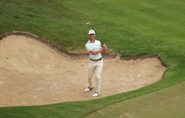 Billy Horschel of the United states of America plays out of a bunker on the 18th hole during Day Two of The BMW PGA Championship at Wentworth Golf...