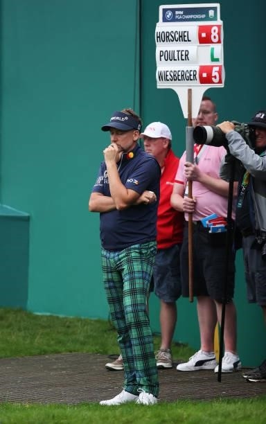 Ian Poulter of England looks on, after finishing his round on the 18th hole during Day Two of The BMW PGA Championship at Wentworth Golf Club on...