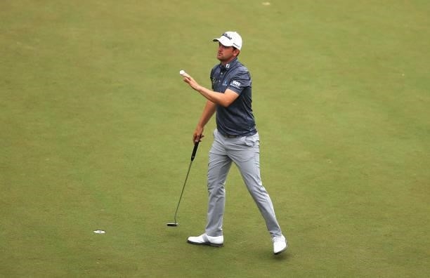 Bernd Wiesberger of Austria acknowledges the crowd after finishing his round on the 18th hole during Day Two of The BMW PGA Championship at Wentworth...