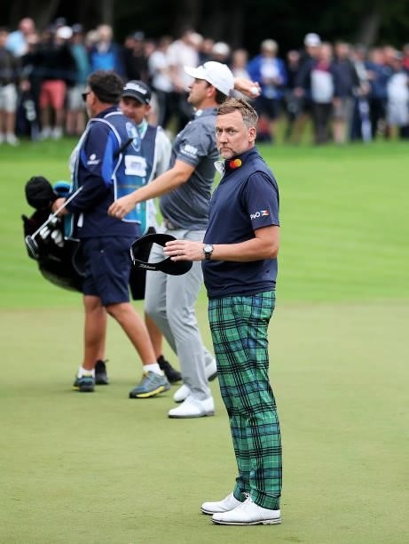 Ian Poulter of England looks on, after finishing his round on the 18th hole during Day Two of The BMW PGA Championship at Wentworth Golf Club on...