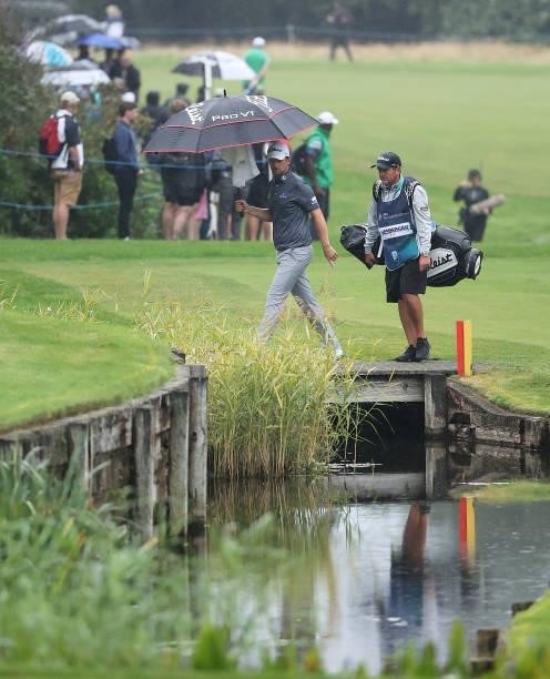 Bernd Wiesberger of Austria walks across the bridge on the way to the 18th green during Day Two of The BMW PGA Championship at Wentworth Golf Club on...
