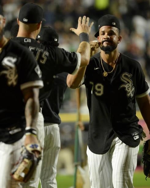 Jose Abreu of the Chicago White Sox celebrates with teammates after the game against the Boston Red Sox on September 10, 2021 at Guaranteed Rate...