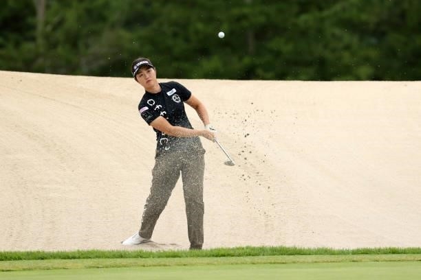 Nozomi Uetake of Japan hits out from a bunker on the 11th hole during the third round of the JLPGA Championship Konica Minolta Cup at Shizu Hills...