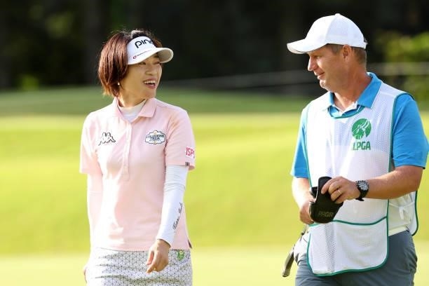 Shiho Oyama of Japan talks with her caddie on the 17th green during the third round of the JLPGA Championship Konica Minolta Cup at Shizu Hills...