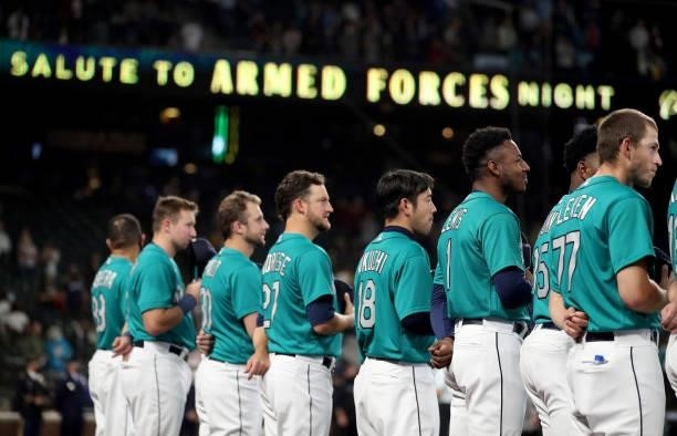 The Seattle Mariners stand during "Salute to Armed Forces Night