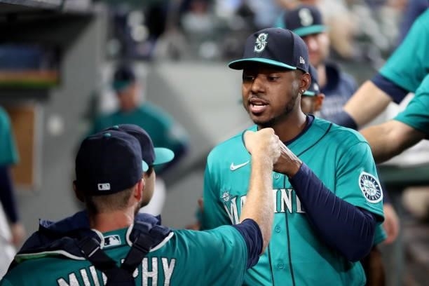 Kyle Lewis of the Seattle Mariners fist bumps Tom Murphy before the game against the Arizona Diamondbacks at T-Mobile Park on September 10, 2021 in...