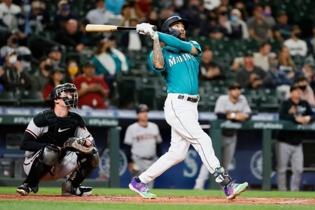 Crawford of the Seattle Mariners watches his home run against the Arizona Diamondbacks during the first inning at T-Mobile Park on September 10, 2021...