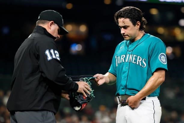 Marco Gonzales of the Seattle Mariners is checked for a foreign sticky substance during the game against the Arizona Diamondbacks at T-Mobile Park on...