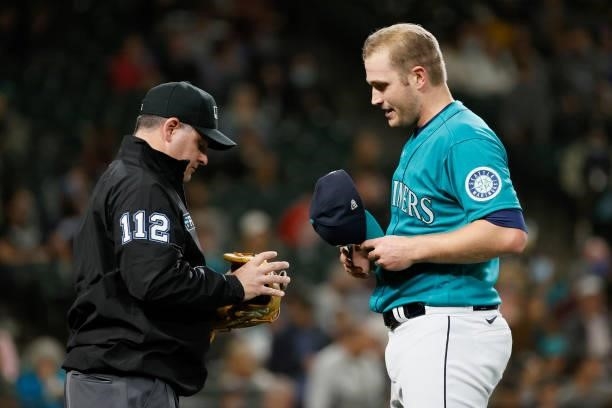 Casey Sadler of the Seattle Mariners is checked for a foreign sticky substance during the game against the Arizona Diamondbacks at T-Mobile Park on...