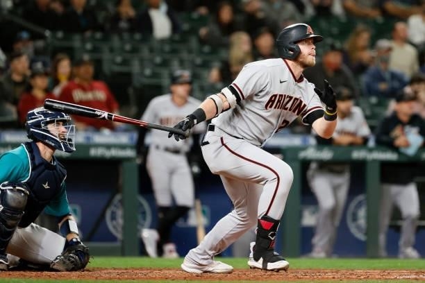 Seth Beer of the Arizona Diamondbacks watches his home run during the eighth inning against the Seattle Mariners at T-Mobile Park on September 10,...
