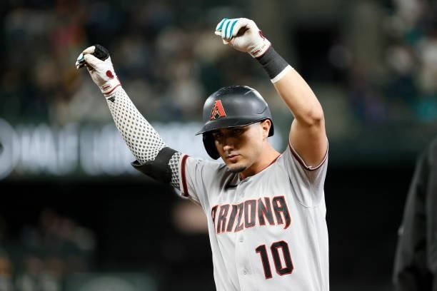 Josh Rojas of the Arizona Diamondbacks reacts after his single against the Seattle Mariners at T-Mobile Park on September 10, 2021 in Seattle,...