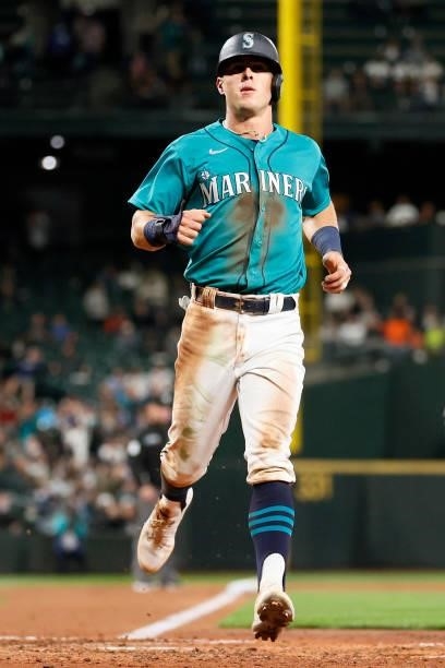 Dylan Moore of the Seattle Mariners scores against the Arizona Diamondbacks during the fifth inning at T-Mobile Park on September 10, 2021 in...