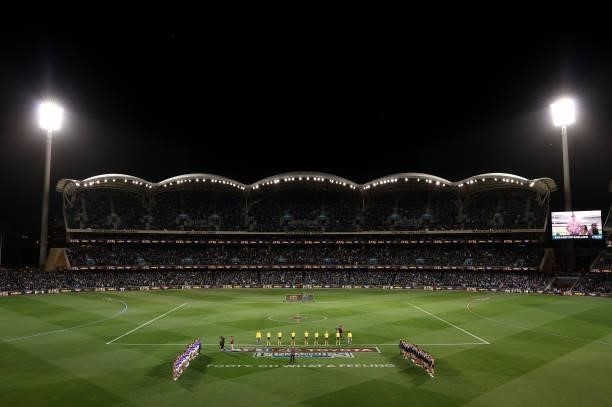 Players line up for the national anthem during the AFL Second Preliminary Final match between Port Adelaide Power and Western Bulldogs at Adelaide...