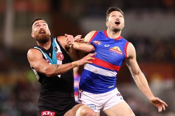 Charlie Dixon of the Power and Stefan Martin of the Bulldogs compete for a mark during the AFL Second Preliminary Final match between Port Adelaide...