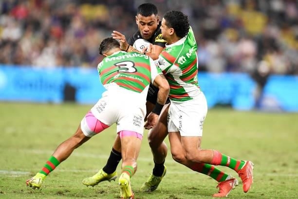 Stephen Crichton of the Panthers is tackled by Dane Gagai and Cody Walker of the Rabbitohs during the NRL Qualifying Final match between Penrith...