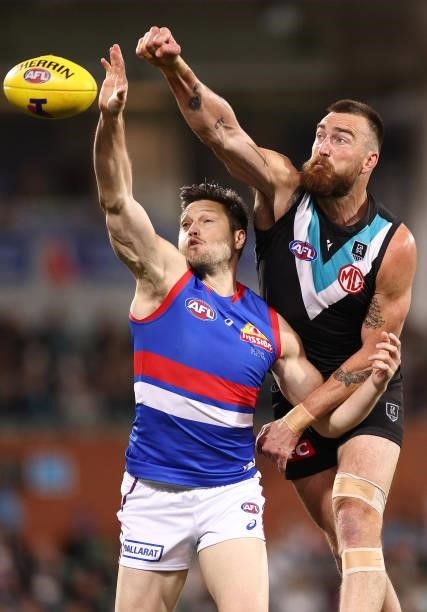 Charlie Dixon of the Power and Stefan Martin of the Bulldogs compete in the ruck during the AFL Second Preliminary Final match between Port Adelaide...