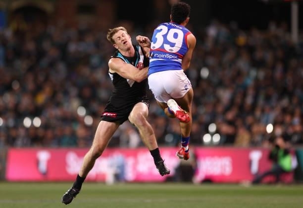 Tom Jonas of the Power and Jason Johannisen of the Bulldogs compete for a mark during the AFL Second Preliminary Final match between Port Adelaide...