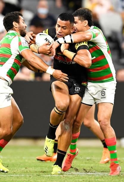Stephen Crichton of the Panthers is tackled by Alex Johnston and Cody Walker of the Rabbitohs during the NRL Qualifying Final match between Penrith...