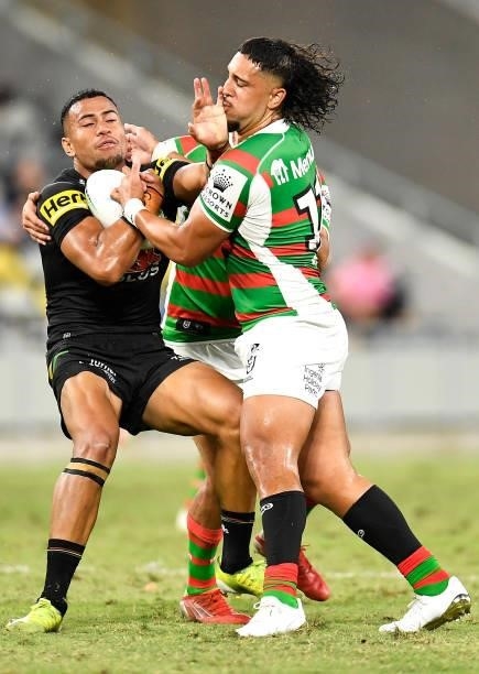 Stephen Crichton of the Panthers is tackled by Keaon Koloamatangi of the Rabbitohs during the NRL Qualifying Final match between Penrith Panthers and...