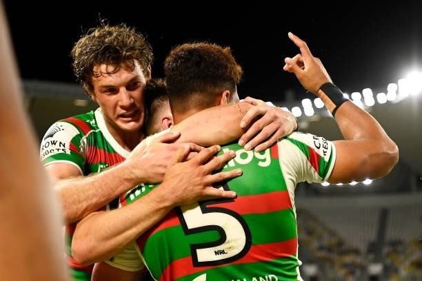 Campbell Graham and Blake Taaffe of the Rabbitohs celebrate with Jaxson Paulo of the Rabbitohs after he scored a try during the NRL Qualifying Final...