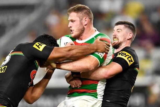 Thomas Burgess of the Rabbitohs is tackled by Tevita Pangai Junior and Matthew Eisenhuth of the Panthers during the NRL Qualifying Final match...