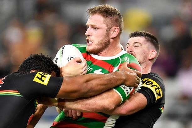 Thomas Burgess of the Rabbitohs is tackled by Tevita Pangai Junior and Matthew Eisenhuth of the Panthers during the NRL Qualifying Final match...