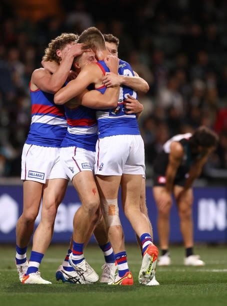 Roarke Smith of the Bulldogs is congratulated by team mates after kicking a goal during the AFL Second Preliminary Final match between Port Adelaide...
